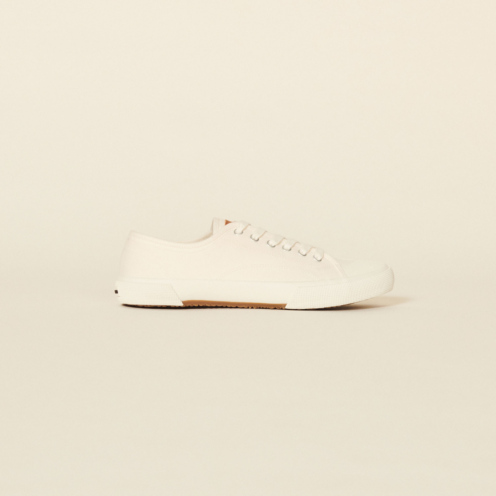 canvas low top trainers